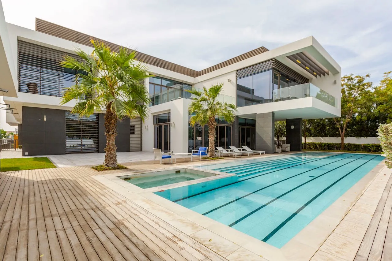 Modern villa with swimming pool at sunset